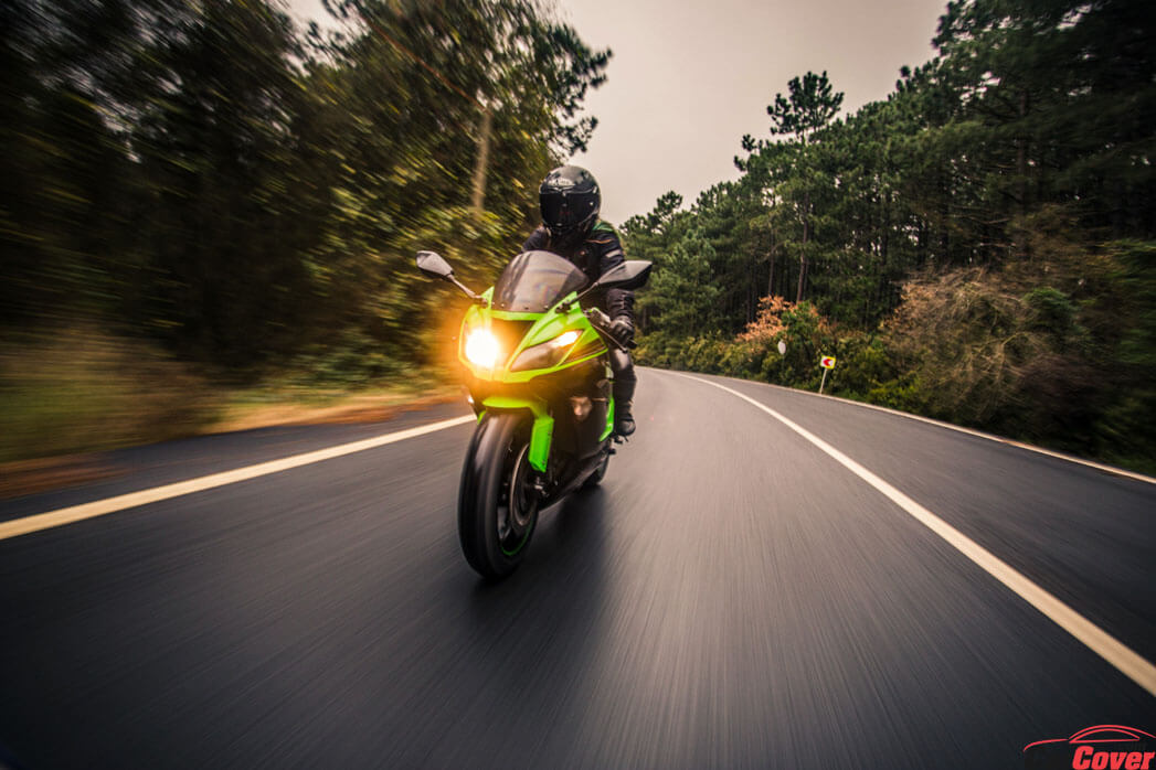 driving-green-neon-color-motorcycle-road-dusk-time